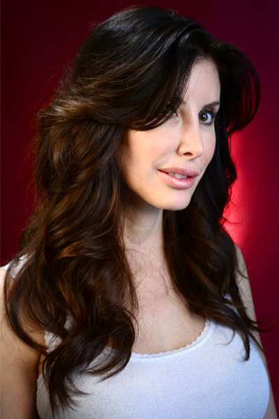 picture of a woman with dark curly hair.